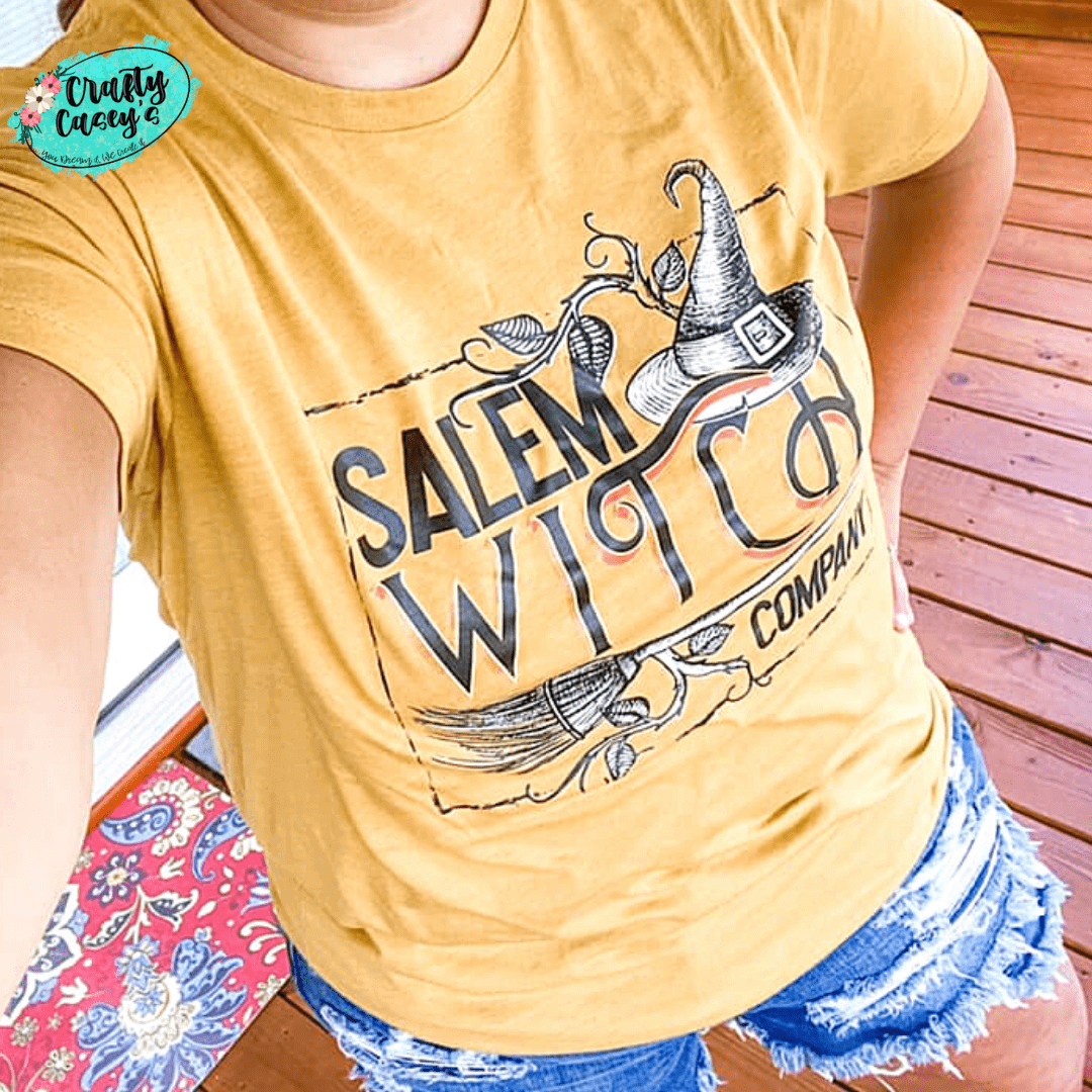 Crafty Casey's Halloween Unisex T-shirts S / Heather Gold / Short Sleeve Salem Witch Company - Women's Halloween Bella Canvas Unisex T-shirts