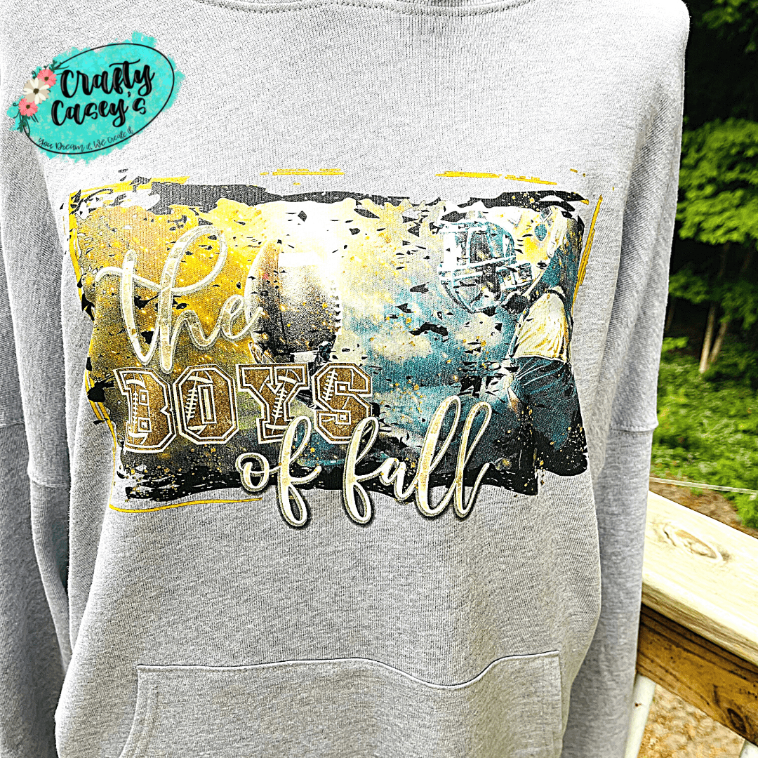 Crafty Casey's Graphic Sports Hoodie S / Athletic Heather The Boy's Of Fall Graphic Football Unisex Hoodie