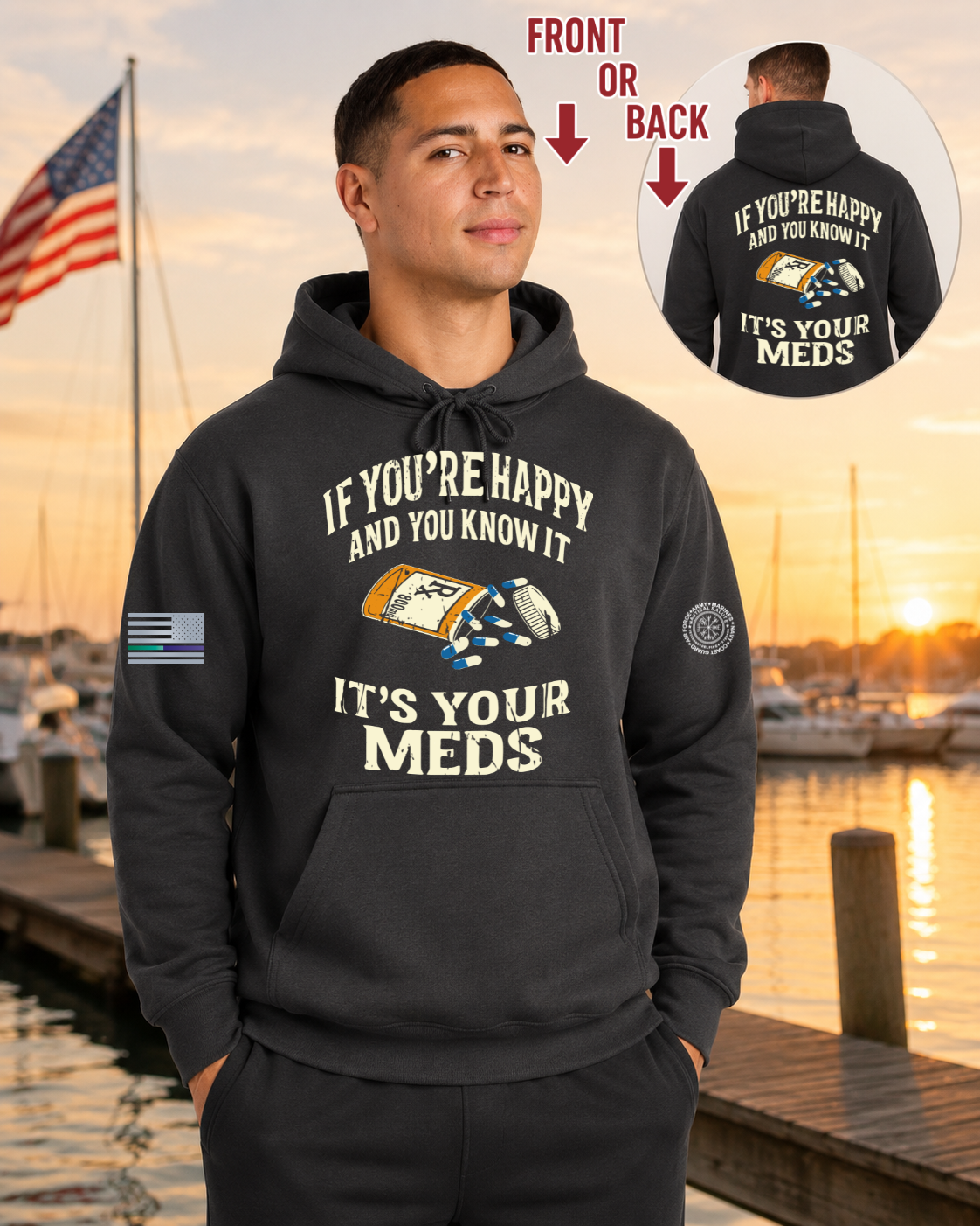 Man wearing a black hoodie with a humorous message by a dock with an American flag.