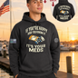 Nautical Salute It’s Your Meds charcoal District Perfect Weight Fleece Hoodie mockup showing front back placement on marina sunset background