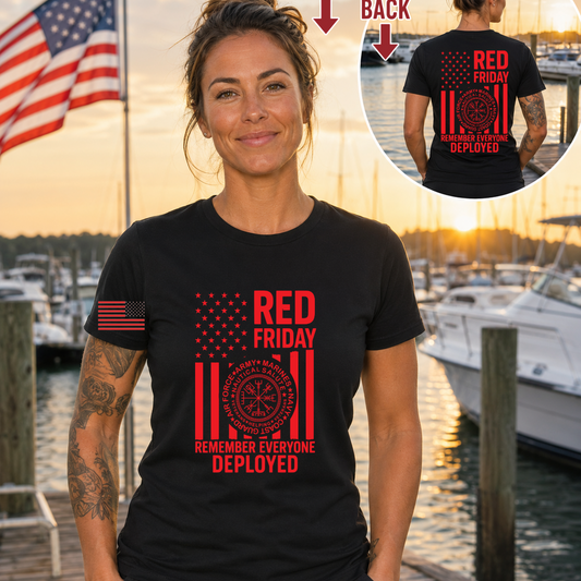 Woman wearing a black t-shirt with 'Red Friday' and American flag design, standing by a marina.