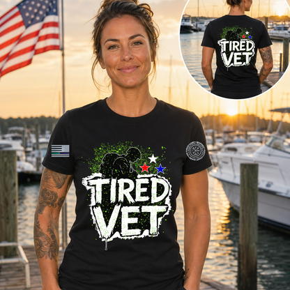 Woman wearing a 'TIRED VET' t-shirt with a marina background